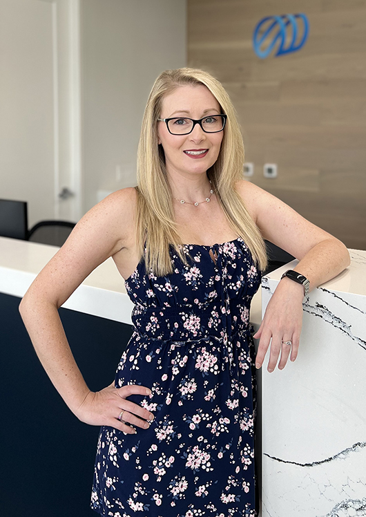 Female staff member posing in clinic